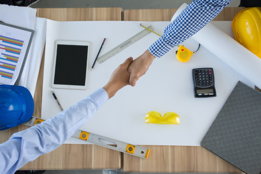 engineer-architect-businessman-shaking-hands-together-teamwork